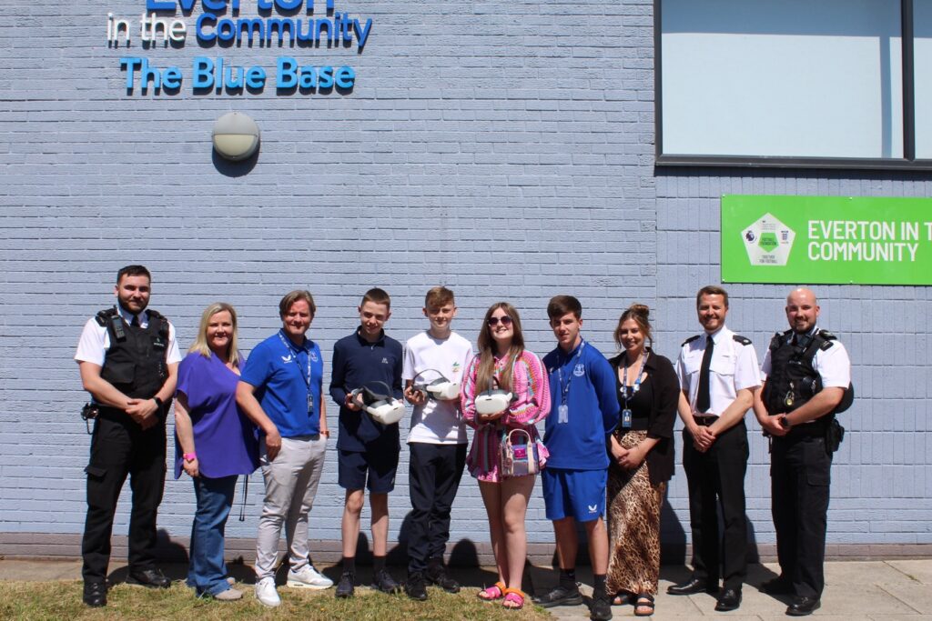 Young people, Merseyside Police officers and Everton in the Community representatives