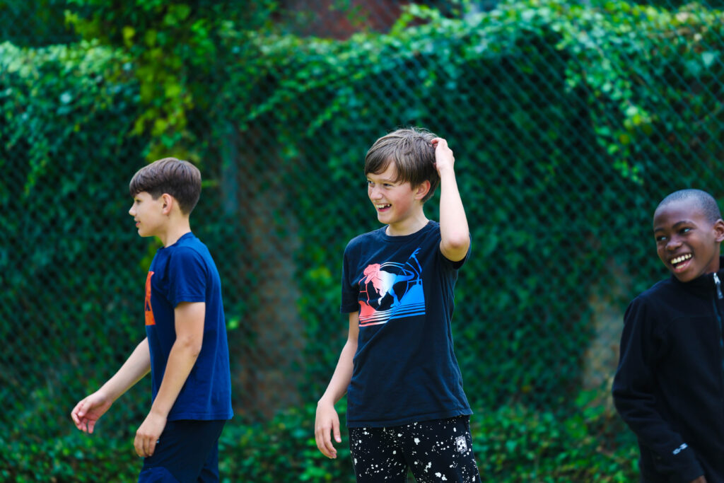 three young boys smiling