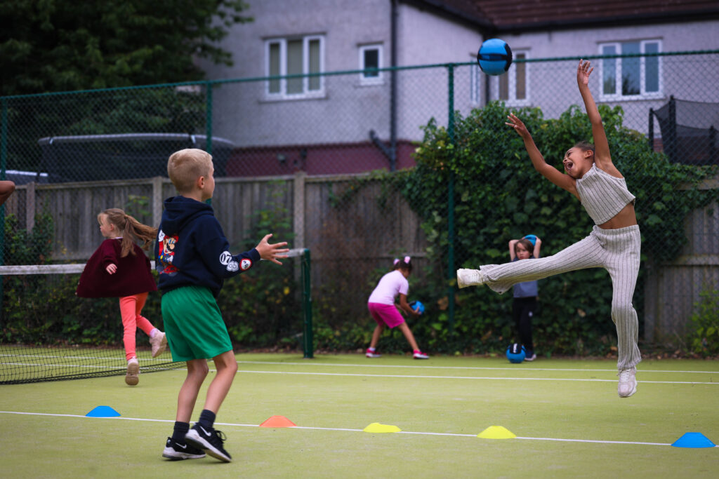 Young people playing dodgeball