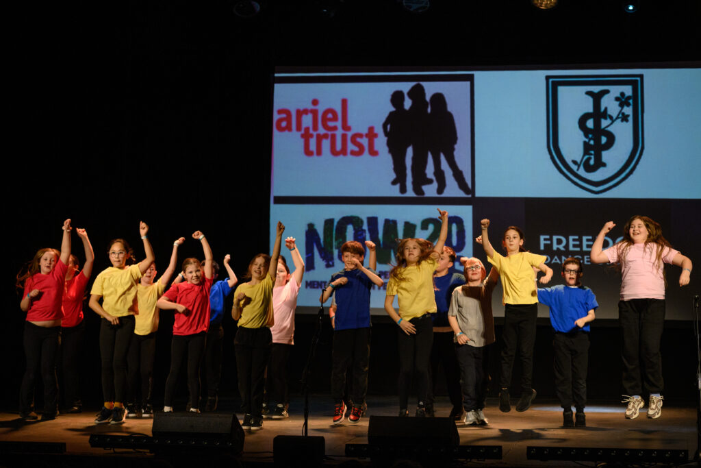 Young people performing on stage at NowFest 26