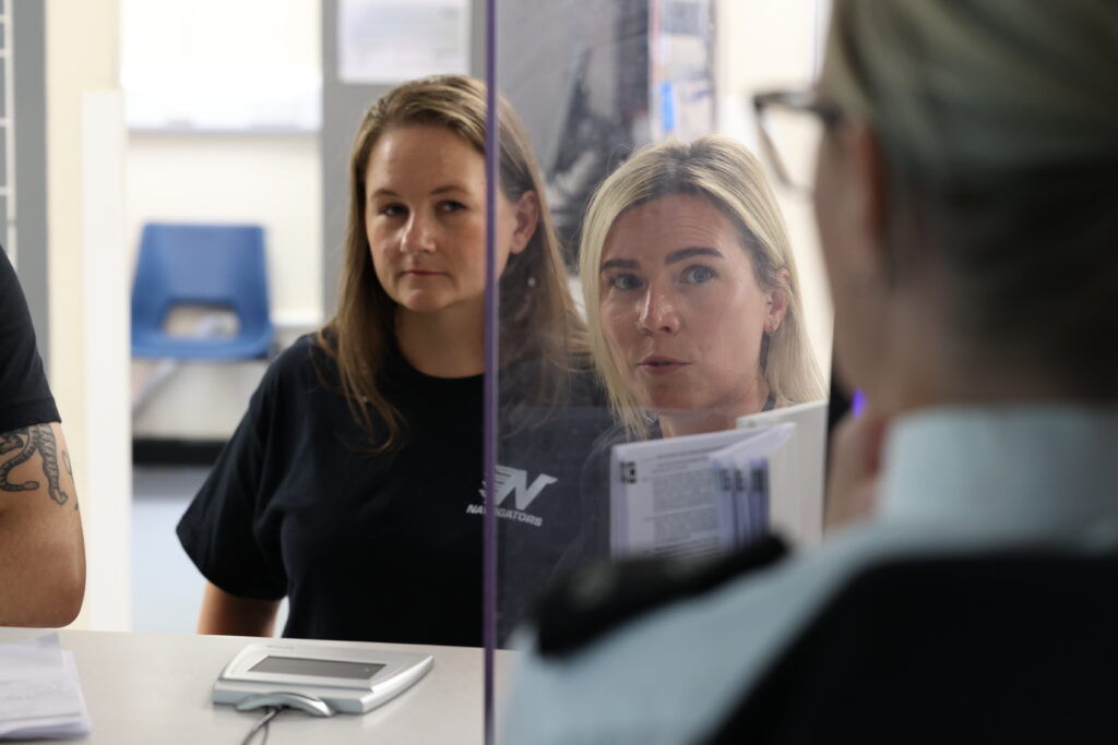 Custody Navigators speaking to a custody officer